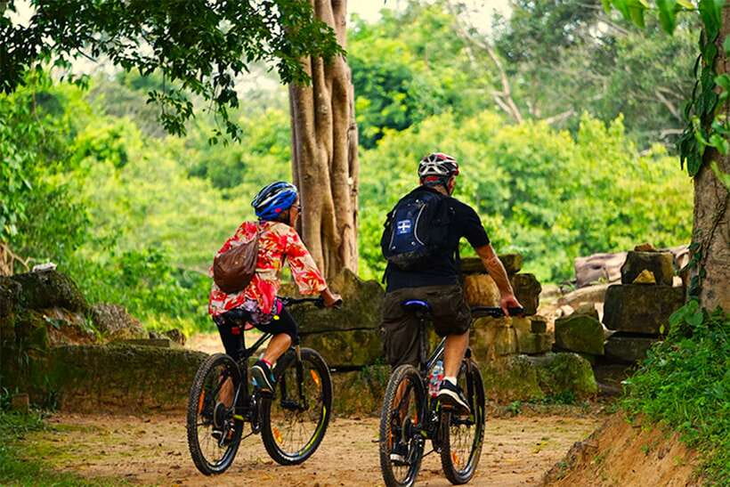 Angkor Jungle Biking Adventure Private Cycling Tour - Ta Prohm and the jungle feeling: temple crumbling, roots, and “Tomb Raider” energy