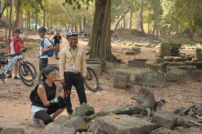 Angkor Sunrise Bike Tour with Lunch Included - Ta Nei Temple in the jungle: a quieter stop with a fruit break