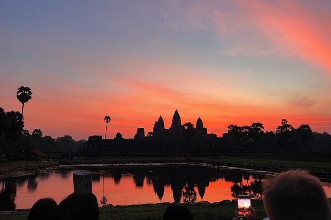 Angkor Sunrise Bike Tour with Lunch Included - Angkor Wat sunrise photos: ponds, towers, and calm light