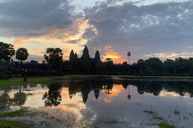 Angkor Wat Sunrise and Tonle Sap Cruise Sunset Tour - Angkor Wat Sunrise: East Gate to West Gate in low light
