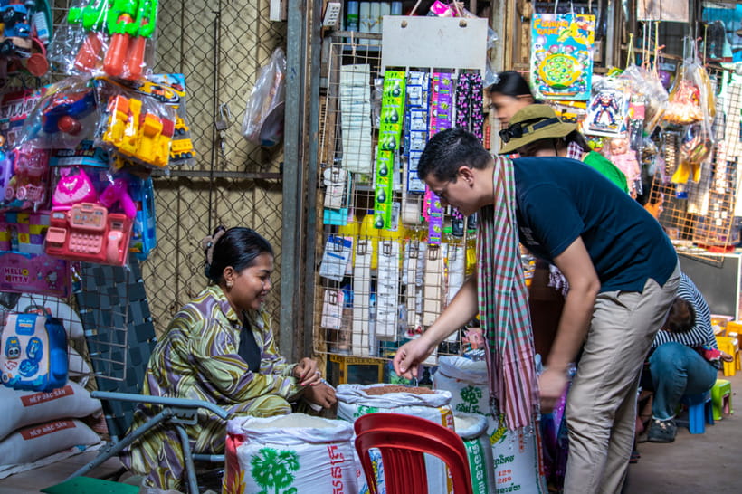 Authentic Siem Reap: Tuk Tuk Countryside and Sunset Tour - Phnom Krom sunset: rice fields, a mat, and lotus dishes