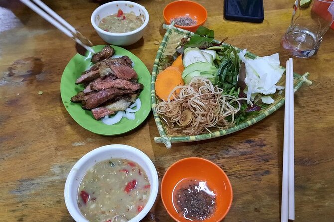Authentic Walking Food Tour with Local Guide - Cambodia–Vietnam Friendship Monument: green curry noodles and the logic of herbs
