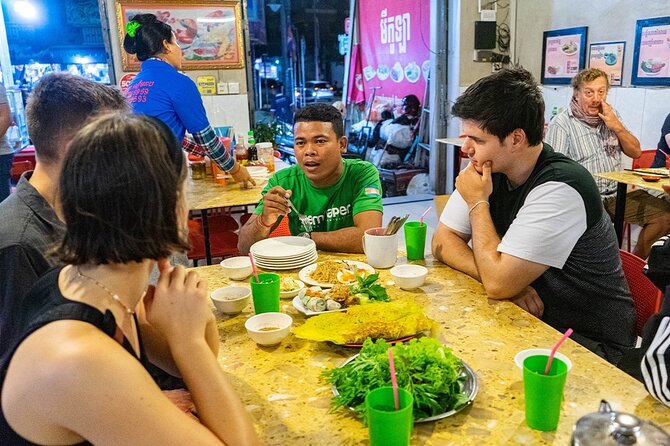 Phnom Penh Evening Food Tour - Inclusive 5 stops local Tastings - Phnom Penh night market time: handicrafts and scarf shopping breaks