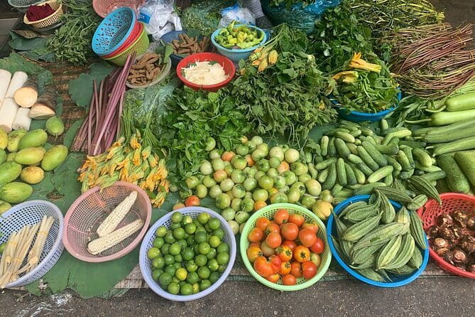 Phnom Penh Morning Breakfast, Market and Art Tour by Tuktuk - Ang Eng Market: produce, people, and Sister Mao’s curry paste
