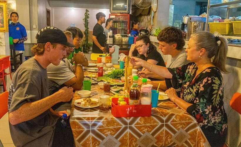 Phnom Penh: Night Foodie Tour by Tuk Tuk with Drinks - Russian Market at night: BBQ chicken, pork ribs, and dessert