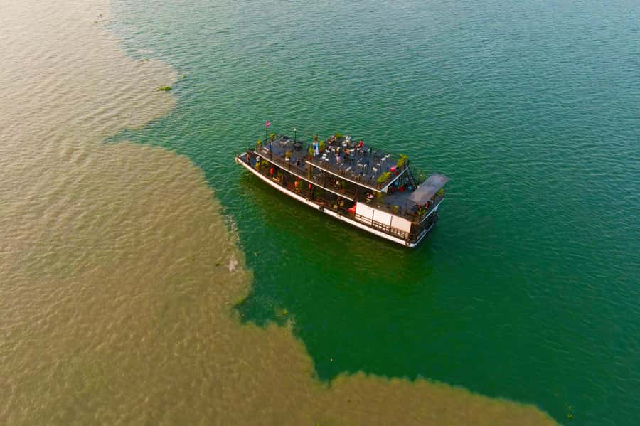 Phnom Penh: Sunset Cruise with Unlimited Beer &Fruit platter - Getting on the water: tuk-tuk pickup and the boat vibe