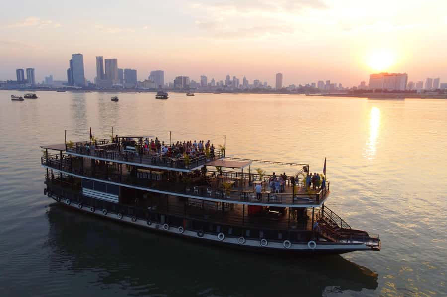 Phnom Penh: Sunset Dinner Cruise with English Speaking Guide - Boarding and getting positioned at the pier