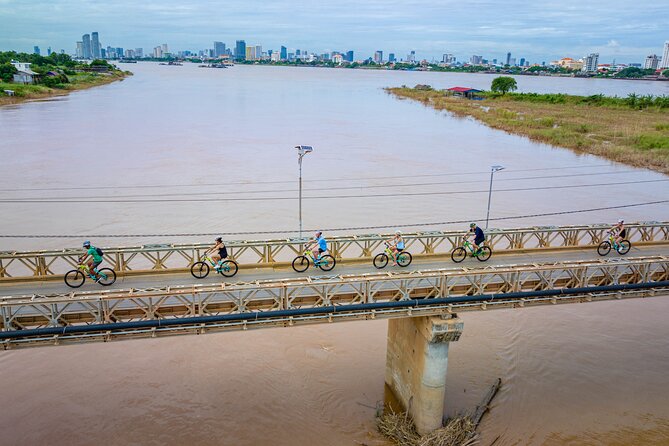 Phnom Penh to Silk Island Sunset Bike Tour/ E-Bike or Tuk Tuk - The Golden Temple Stop Before You Roll Out