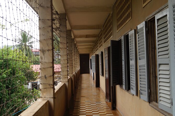 Remnants of a Khmer Rouge Era - Cheung Ek Killing Fields: mass graves, a memorial stupa, and scale you can feel