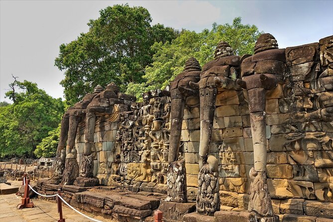 Siem Reap: Angkor Wat Sunrise Bike Tour & Jungle Breakfast - Bayon and the Terrace of the Elephants: where details matter